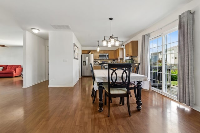 774 Dover St, Pingree Grove, IL 60140 - dining room with dark wood-style flooring and a chandelier