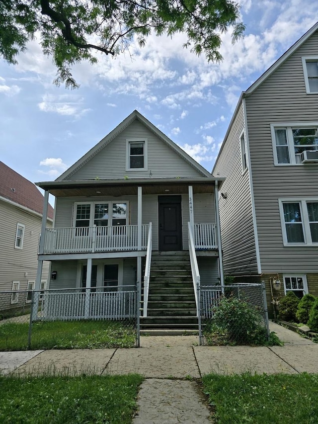 3447 W Melrose St, Chicago, IL 60618 - view of front facade with a porch, stairway, and cooling unit
