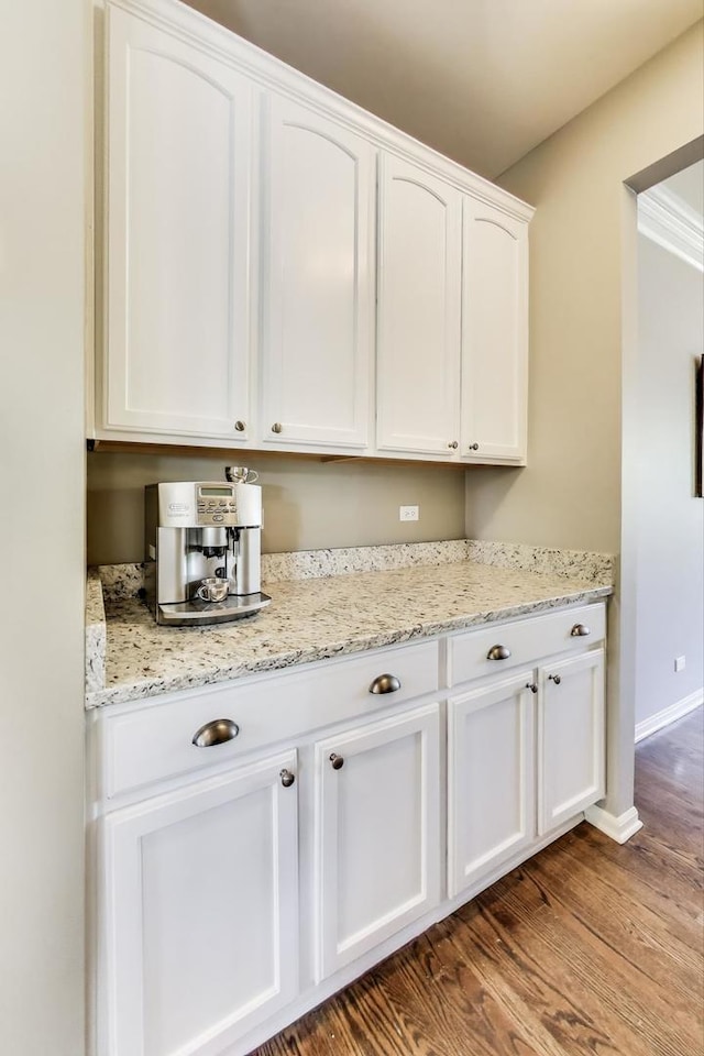 2301 Bluewater Dr, Wauconda, IL 60084 - kitchen with white cabinets, dark wood-type flooring, and light stone counters