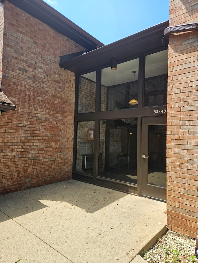 740 Saint Andrews Ln Unit 37, Crystal Lake, IL 60014 - property entrance featuring brick siding