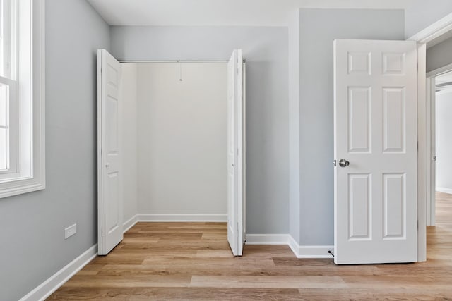 676 Cleo Ct Unit 676, Wheeling, IL 60090 - unfurnished bedroom featuring light wood finished floors and a closet