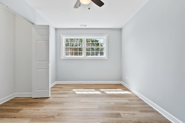 676 Cleo Ct Unit 676, Wheeling, IL 60090 - unfurnished bedroom featuring light wood-type flooring, a closet, and ceiling fan