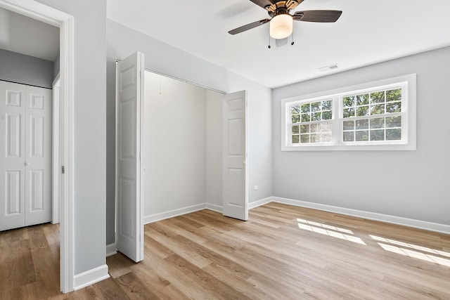 676 Cleo Ct Unit 676, Wheeling, IL 60090 - unfurnished bedroom featuring light wood-style flooring and ceiling fan