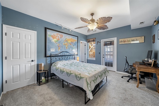 3251 N Racine Ave Unit 3, Chicago, IL 60657 - bedroom featuring light colored carpet, access to outside, rail lighting, an office area, and a ceiling fan
