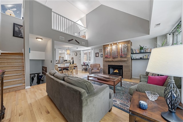 3251 N Racine Ave Unit 3, Chicago, IL 60657 - living area featuring light wood finished floors, a large fireplace, and stairway