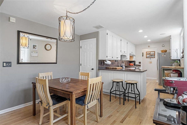 3251 N Racine Ave Unit 3, Chicago, IL 60657 - dining space featuring light wood-type flooring and recessed lighting