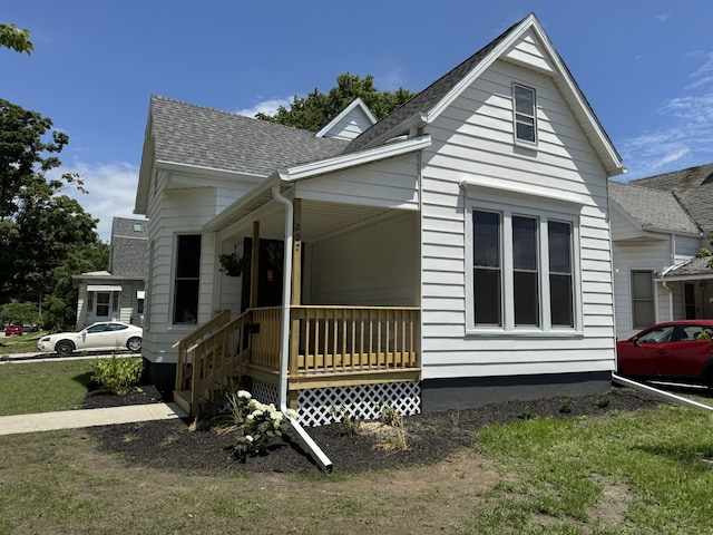 207 W Graham St, Bloomington, IL 61701 - view of front facade with a shingled roof and a porch