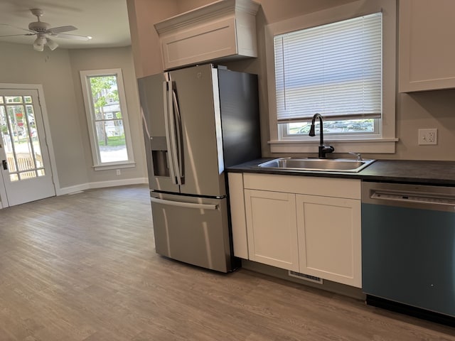 207 W Graham St, Bloomington, IL 61701 - kitchen with stainless steel fridge with ice dispenser, dishwashing machine, dark countertops, and healthy amount of natural light