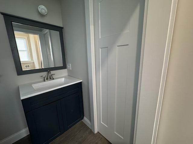 207 W Graham St, Bloomington, IL 61701 - bathroom featuring vanity and wood finished floors