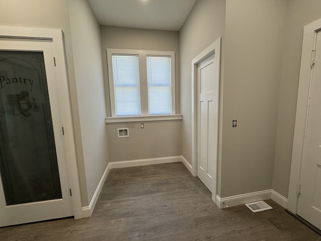 207 W Graham St, Bloomington, IL 61701 - washroom featuring washer hookup and wood finished floors