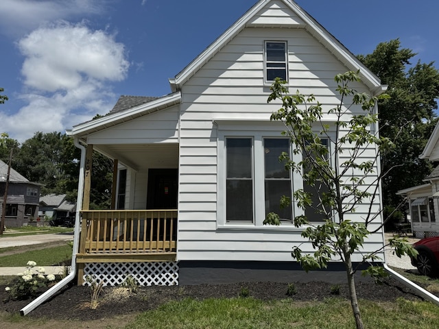 207 W Graham St, Bloomington, IL 61701 - view of home's exterior featuring covered porch