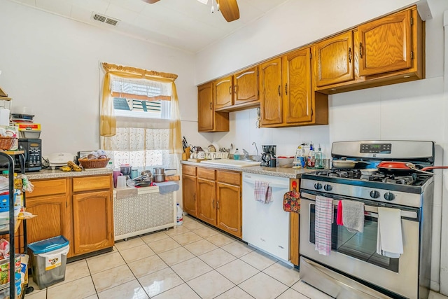 4438 N Moody Ave, Chicago, IL 60630 - kitchen featuring stainless steel gas range oven, dishwasher, a ceiling fan, and light countertops