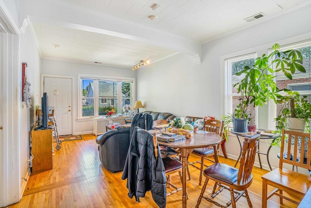 4438 N Moody Ave, Chicago, IL 60630 - dining space with healthy amount of natural light, light wood-style floors, and track lighting