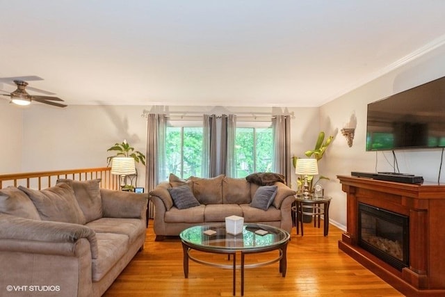 2S200 Valley Rd, Lombard, IL 60148 - living area with light wood-type flooring, ceiling fan, a glass covered fireplace, and ornamental molding