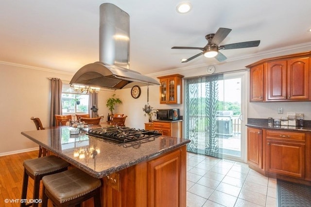 2S200 Valley Rd, Lombard, IL 60148 - kitchen with island range hood, gas cooktop, a breakfast bar area, crown molding, and brown cabinetry