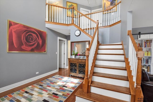 1505 Della Dr, Hoffman Estates, IL 60169 - stairway featuring wood finished floors and a high ceiling