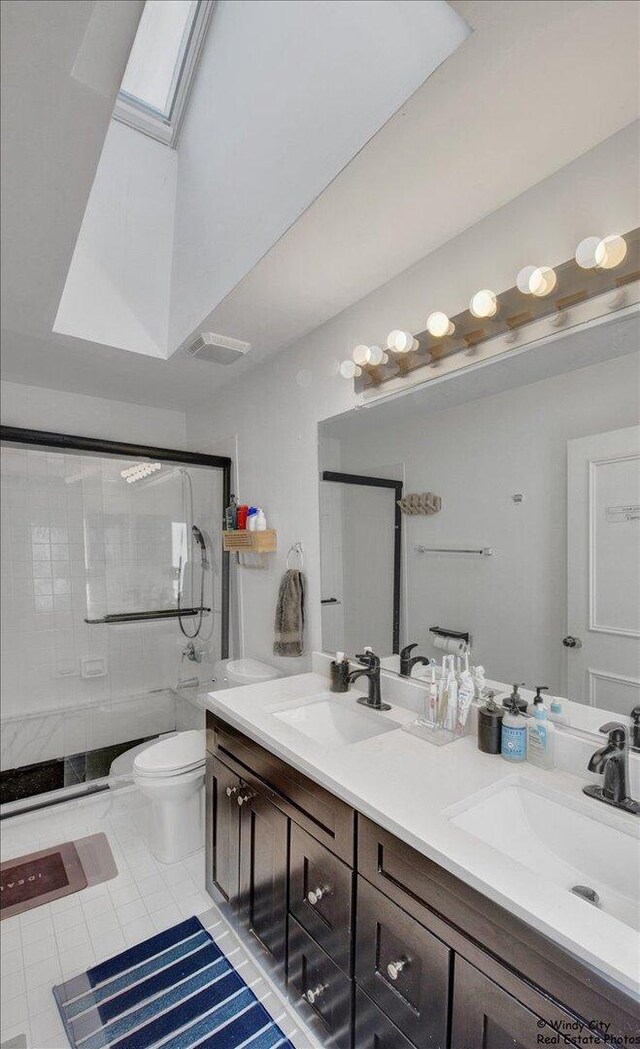 1505 Della Dr, Hoffman Estates, IL 60169 - full bathroom featuring a skylight, double vanity, a shower stall, and tile patterned flooring