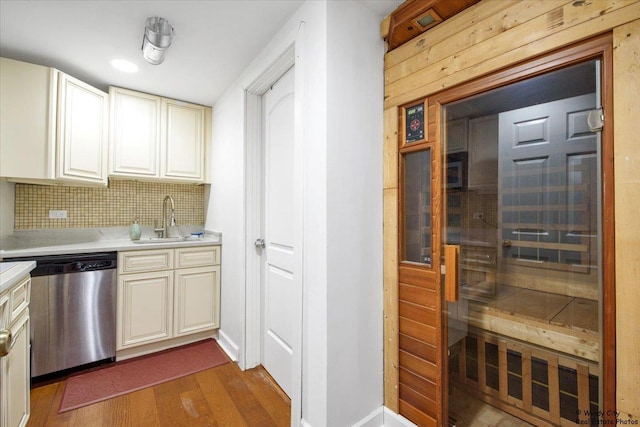 1505 Della Dr, Hoffman Estates, IL 60169 - kitchen featuring stainless steel dishwasher, light countertops, dark wood finished floors, decorative backsplash, and a relaxing sauna