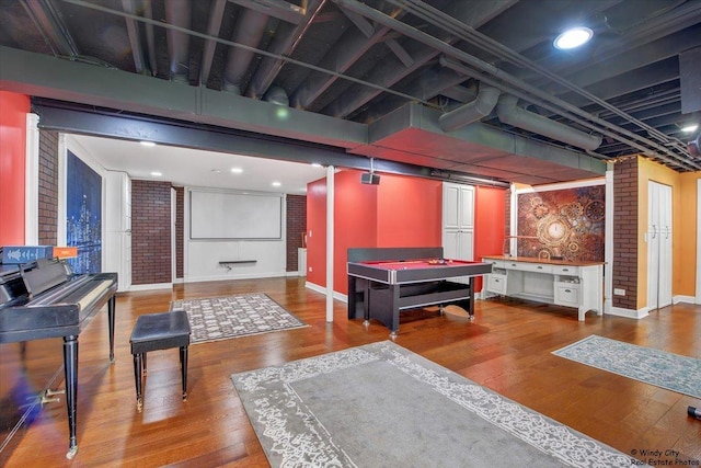 1505 Della Dr, Hoffman Estates, IL 60169 - game room featuring wood finished floors and brick wall