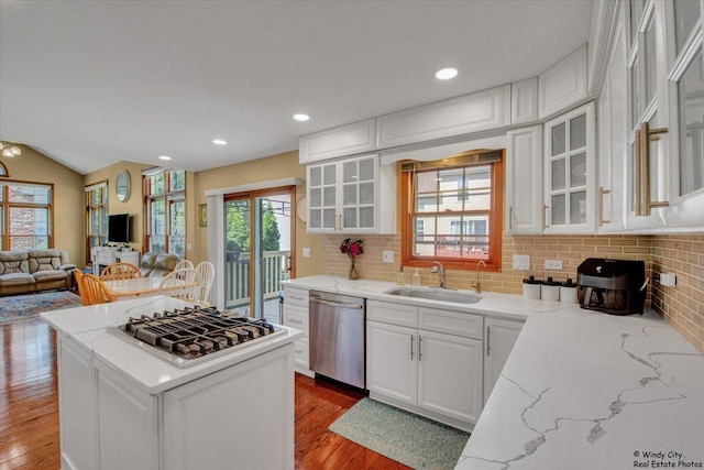1505 Della Dr, Hoffman Estates, IL 60169 - kitchen featuring appliances with stainless steel finishes, wood finished floors, white cabinetry, recessed lighting, and lofted ceiling