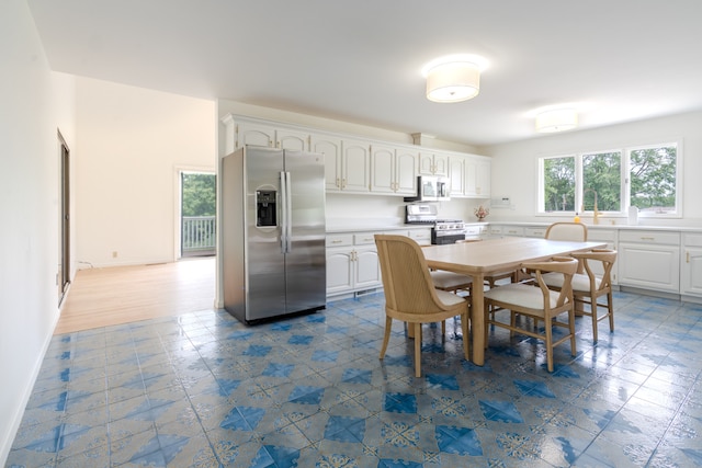 921 Cassie Dr, Joliet, IL 60435 - dining area with dark floors and baseboards