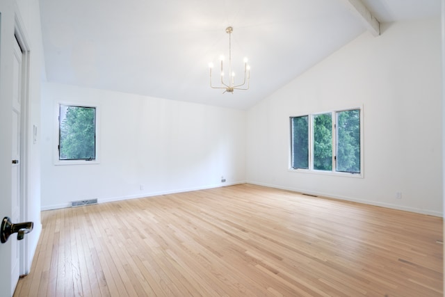 921 Cassie Dr, Joliet, IL 60435 - spare room with a chandelier, light wood-style floors, beamed ceiling, and high vaulted ceiling
