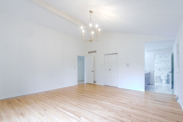 921 Cassie Dr, Joliet, IL 60435 - empty room with a chandelier, high vaulted ceiling, and light wood-type flooring
