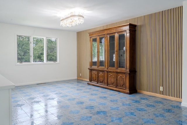 921 Cassie Dr, Joliet, IL 60435 - spare room with a chandelier and tile patterned floors