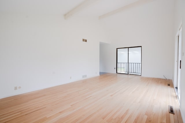 921 Cassie Dr, Joliet, IL 60435 - empty room featuring light wood-type flooring, beamed ceiling, and high vaulted ceiling
