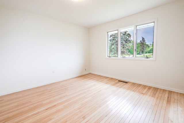 921 Cassie Dr, Joliet, IL 60435 - spare room with hardwood / wood-style flooring and baseboards