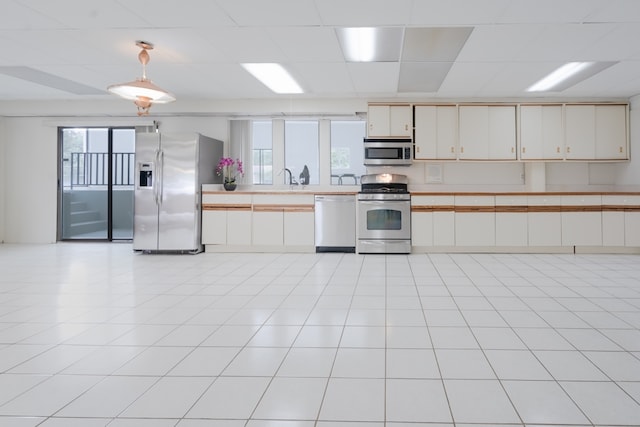 921 Cassie Dr, Joliet, IL 60435 - kitchen featuring appliances with stainless steel finishes, light countertops, pendant lighting, white cabinets, and a drop ceiling