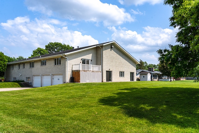 921 Cassie Dr, Joliet, IL 60435 - rear view of house featuring a garage, a lawn, brick siding, and driveway