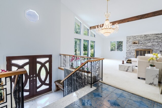 921 Cassie Dr, Joliet, IL 60435 - staircase featuring a chandelier, beamed ceiling, high vaulted ceiling, french doors, and carpet floors