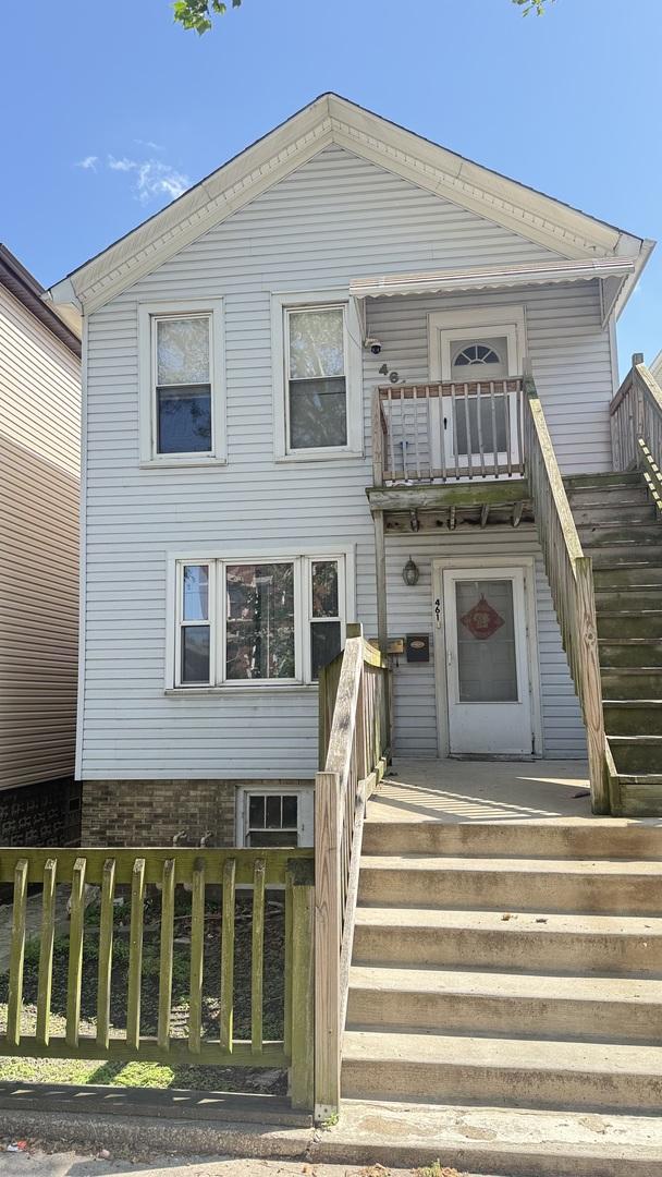 461 W 28th Pl, Chicago, IL 60616 - view of front facade featuring stairway and a balcony