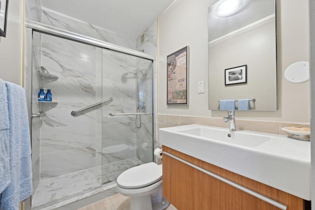 1325 N State Pkwy Unit 8E, Chicago, IL 60610 - bathroom featuring vanity, a marble finish shower, and tile walls