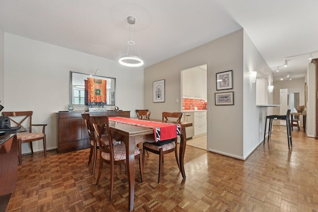 1325 N State Pkwy Unit 8E, Chicago, IL 60610 - dining space with baseboards and track lighting