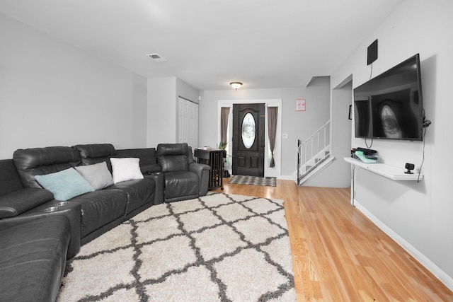 1100 Singleton Dr, Roselle, IL 60172 - living area with light wood-type flooring and stairway