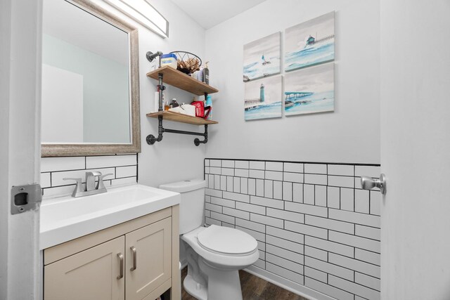 1100 Singleton Dr, Roselle, IL 60172 - half bath with tile walls, vanity, and wood finished floors
