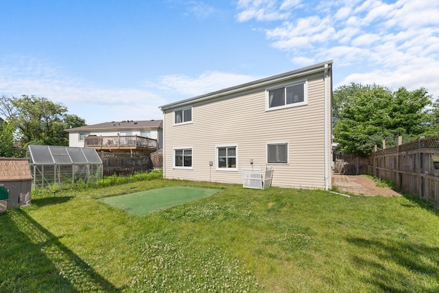 1100 Singleton Dr, Roselle, IL 60172 - back of house with an exterior structure, a fenced backyard, and an outbuilding