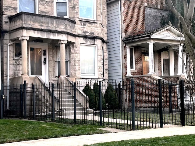 property entrance with stone siding