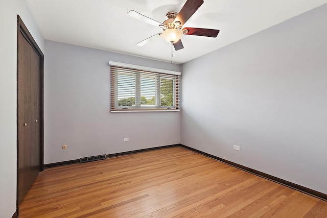 15363 Sunflower Ct, Orland Park, IL 60462 - unfurnished bedroom with a closet, light wood-style flooring, and ceiling fan