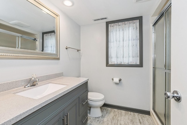 15363 Sunflower Ct, Orland Park, IL 60462 - full bathroom featuring vanity, wood finished floors, and a shower with shower door