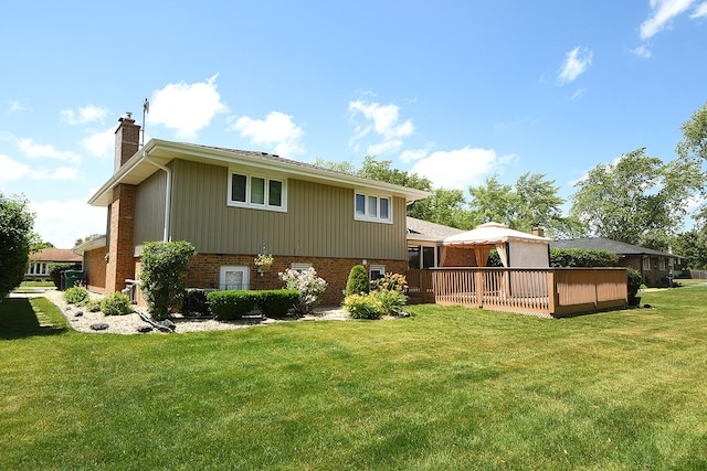 15363 Sunflower Ct, Orland Park, IL 60462 - rear view of property featuring a chimney, brick siding, a yard, and a deck