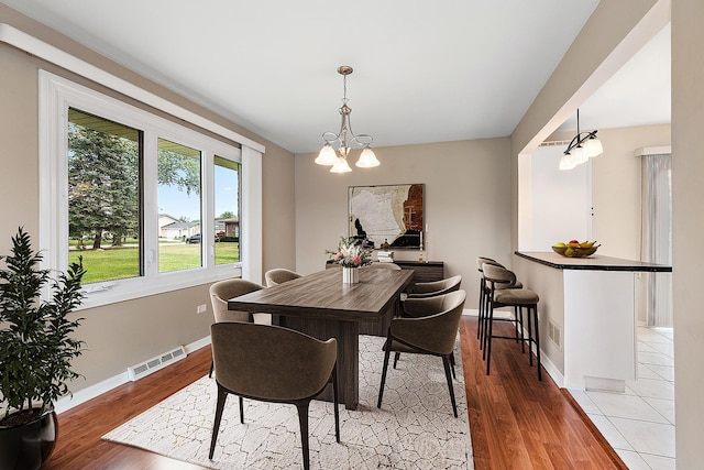15363 Sunflower Ct, Orland Park, IL 60462 - dining space with a chandelier and light wood-type flooring