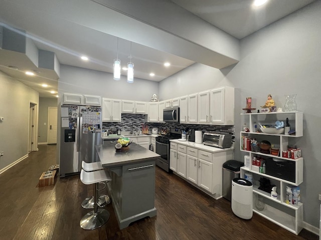 3630 N Harlem Ave Unit 407, Chicago, IL 60634 - kitchen with stainless steel appliances, white cabinets, dark wood-style flooring, backsplash, and recessed lighting