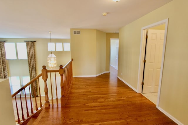 18737 W Ash Dr, Lake Villa, IL 60046 - hallway with wood finished floors and an upstairs landing