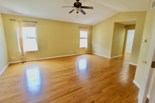 18737 W Ash Dr, Lake Villa, IL 60046 - empty room featuring plenty of natural light, ceiling fan, light wood-style floors, and vaulted ceiling