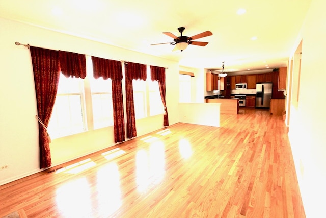 18737 W Ash Dr, Lake Villa, IL 60046 - unfurnished living room with light wood-style floors, ceiling fan, and recessed lighting