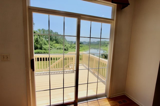 18737 W Ash Dr, Lake Villa, IL 60046 - doorway with baseboards and a water view