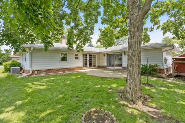 534 Grosvener Ln, Elk Grove Village, IL 60007 - back of house featuring a chimney, a patio area, and a lawn